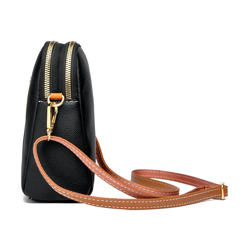 Bolsa compacta de couro Lucy